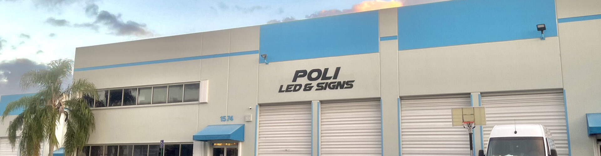 Exterior view of Poli LED & Signs store located at 1574 NW 108th Ave, Miami, FL, 33017. The storefront features a welcoming entrance with prominent LED displays.